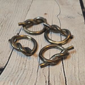 Set of Four Silver Tone Metal Knot Napkin Rings